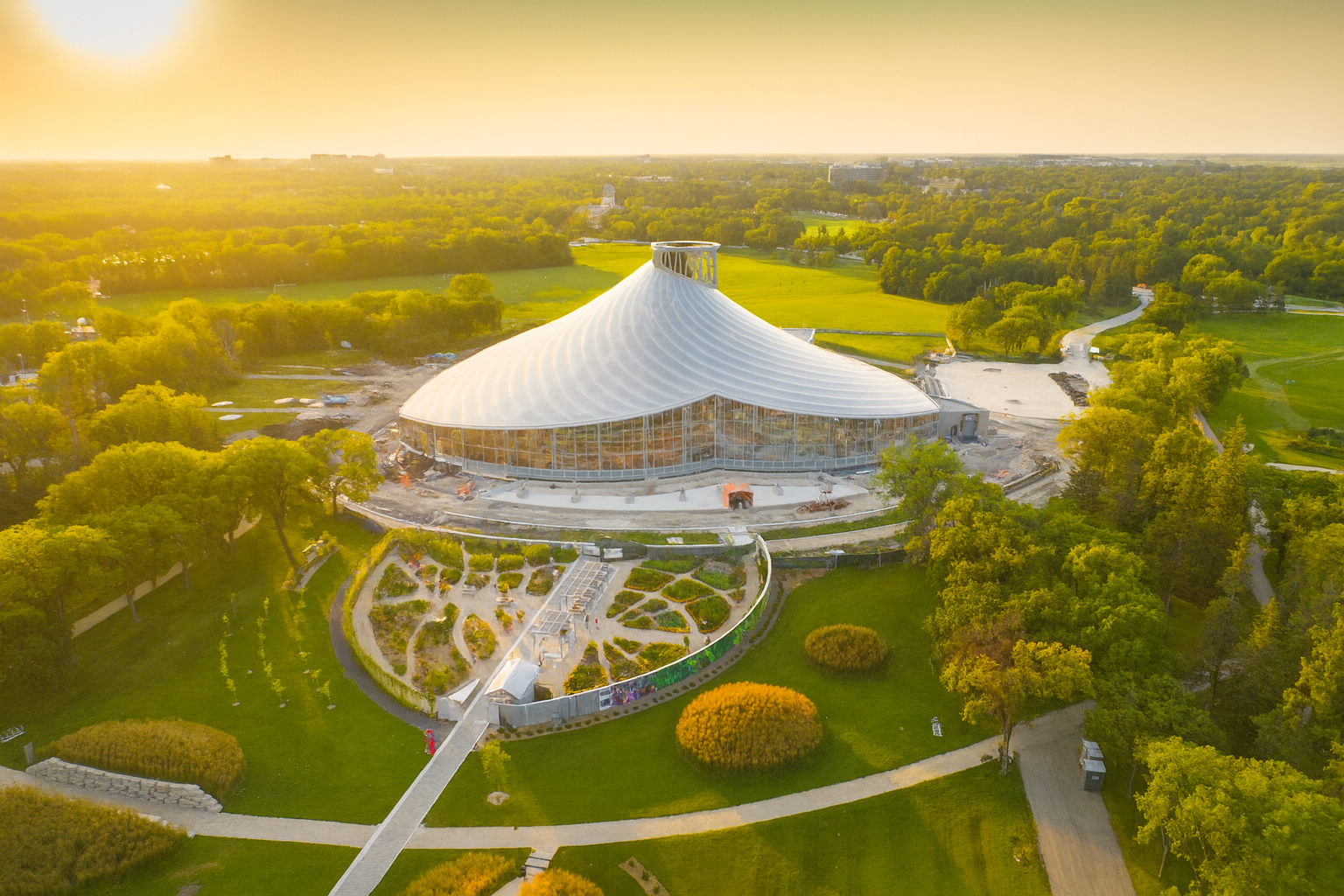 Transparent ETFE canopy at Assiniboine Park in Winnipeg designed by Lightspan, blending modern structure with nature and soft daylight.